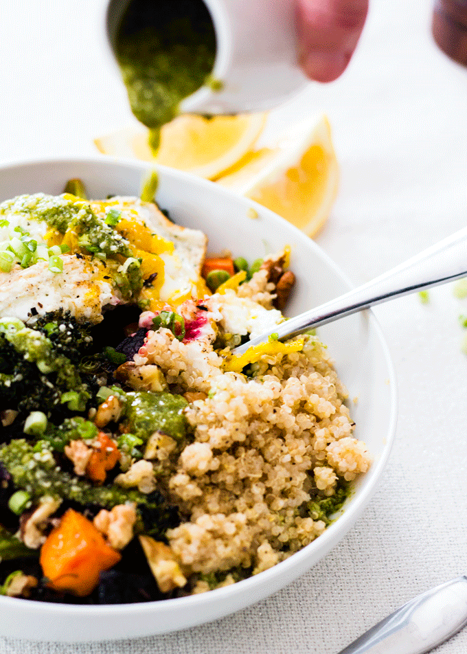 Roasted winter vegetable quinoa bowl with basil hummus dressing