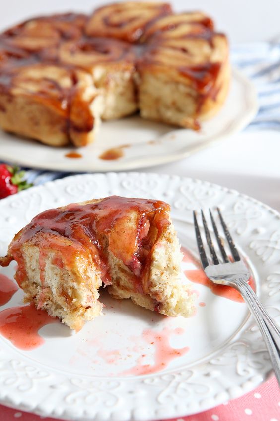 Strawberry Cinnamon Breakfast Buns are the perfect baked good for Mother's Day! This dairy-free adaptation of a classic cinnamon roll takes on seasonal flavors with the addition of fresh strawberries. This treat is drizzled with a strawberry glaze as a final touch. Serve these buns up with a mimosa, and brunch is served!