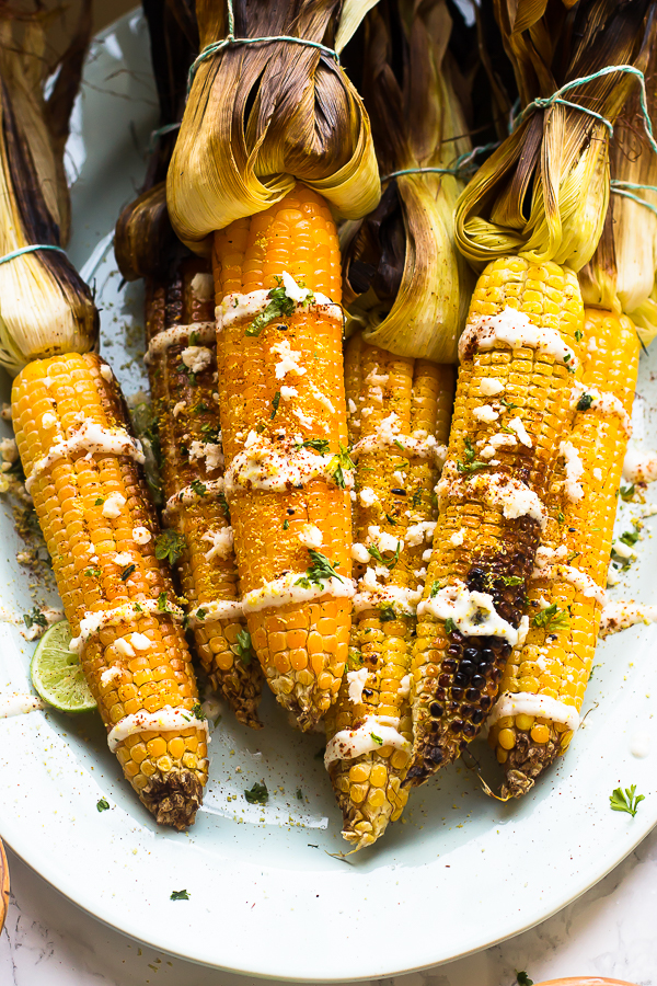 This-Grilled-Mexican-Street-Corn-is-grilled-to-smoky-perfection-then-smothered-in-a-delicous-and-creamy-Lime-Crema.-Its-the-best-side-dish-5