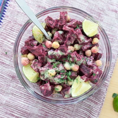 This Beet & Chickpea Salad with Coconut Lime Dressing is packed with tropical flair. Healthy and Easy to Make Ahead! The dressing packs a tangy citrusy punch with lots of yummy cilantro! It's a great dressing for anything you want to give a tropical boost! | BEETS | BEANS | CHICKPEAS | SALAD | VEGETARIAN | VEGAN | HEALTHY | Recipe at OatandSesame.com