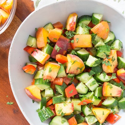 This Sweet Peach Cucumber Salad incorporates all the wonderful produce from your local farmer's market! Fresh cucumbers, red peppers, peaches and fresh herbs! Summer flavors that speak for themselves without any fuss. | GLUTEN FREE | VEGETARIAN | VEGAN | PLANT BASED | PEACHES | SALAD | HEALTHY | Recipe at OatandSesame.com